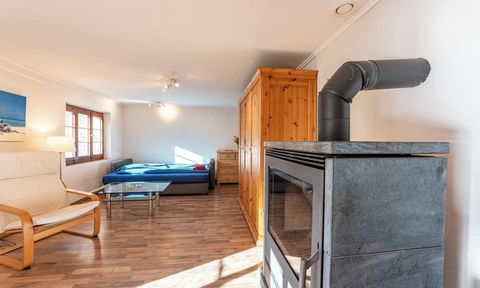 Kandergrund Ski Chalet | Cozy chalet with wood burning stove surrounded by Swiss Alps