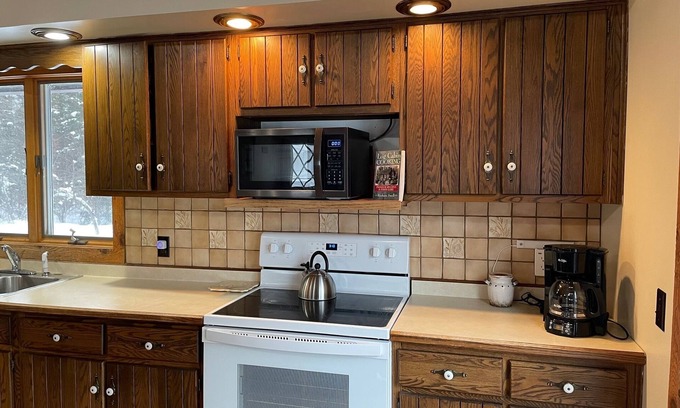 Deerton Cabin | Cozy Welcoming Laughing Whitefish River Cabin Ready For Your Visit
