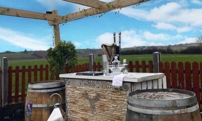 Ballinadee House | Double decker bus and hot tub/bar and patio