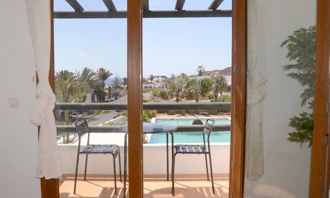 Charco del Palo Cottage | Duplex B16 in a quiet complex with pool 150 m from the sea