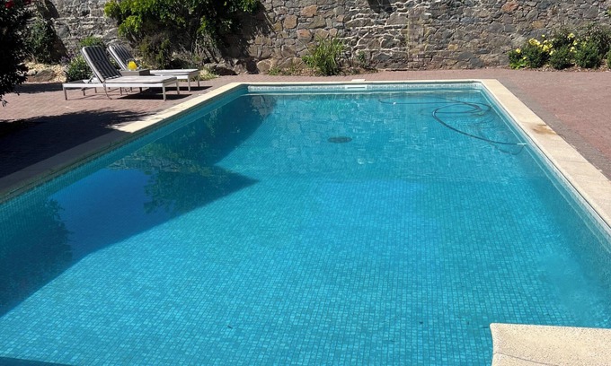 Saint Andrew Apartment | Elegant studio and tranquil pool, central location.