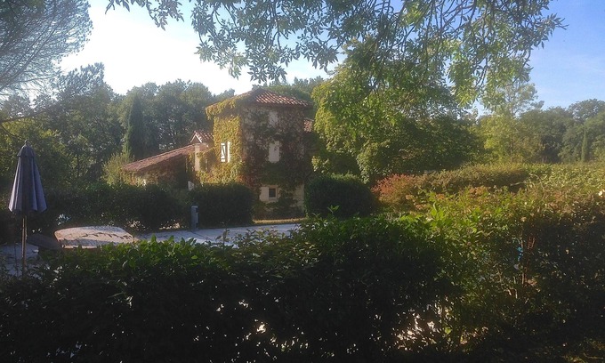 Lussan House | Enchanting stone farmhouse, pool, tennis court and several hectares of grounds.