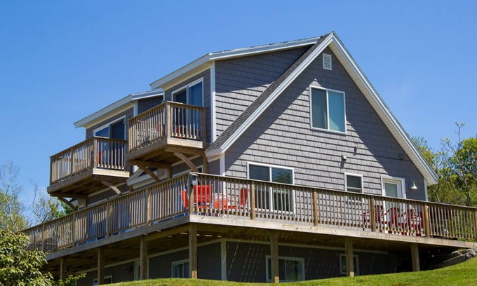 Mid-Coast and Islands House | Enjoy spectacular sunset and water views from the deck and balconies with water access.