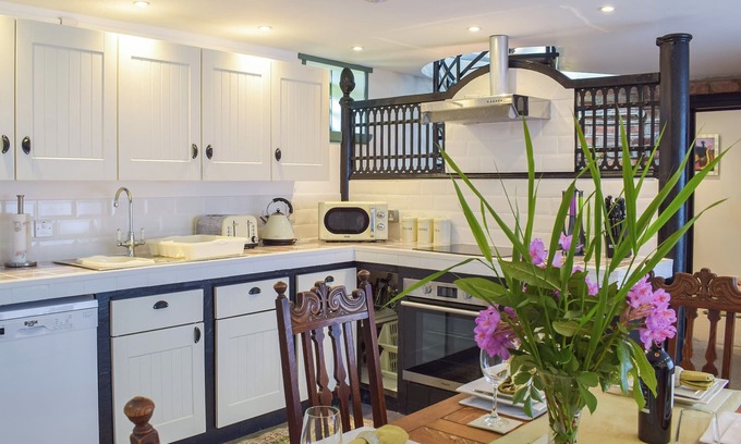 Kilcreggan Cottage | Enjoy the stunning loch views from the lounge or outdoor seating area.