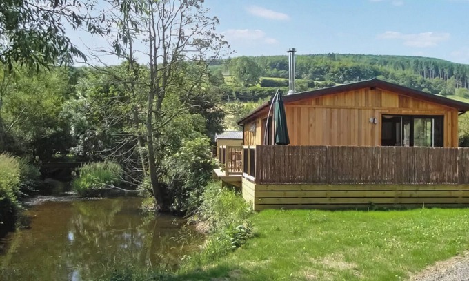 Hopton Castle Cottage | Escape to a modern riverside lodge, perfectly set by the tranquil River Clun.
