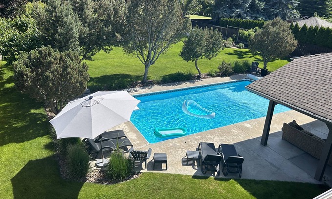 Crawford House | Family Vacation Oasis: Heated Pool, 5 bedrooms, 1/2 acre property, covered patio