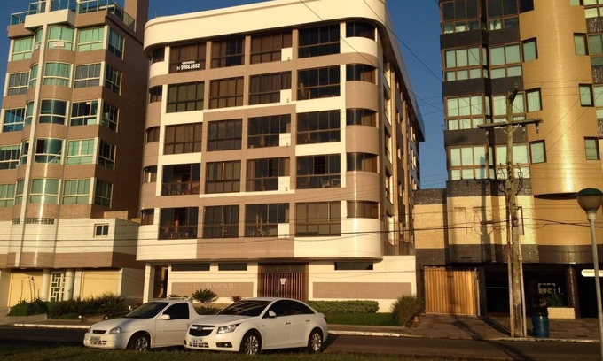 Capao da Canoa Apartment | Fit. facing the sea, 2 bedrooms with 1 suite, barbecue and garage