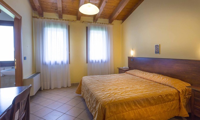 Palazzolo dello Stella Apartment | Folaghe 3, apartment with terrace overlooking the grove