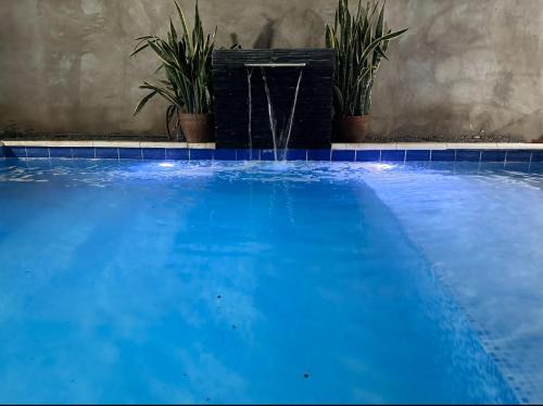 Capiata House | Habitación y piscina en casa compartida