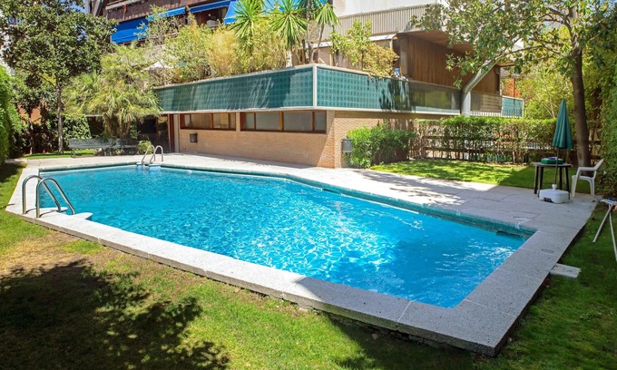 Nueva Espana Apartment | Homerez - Studio for 2 ppl. with shared pool, garden and terrace at Madrid