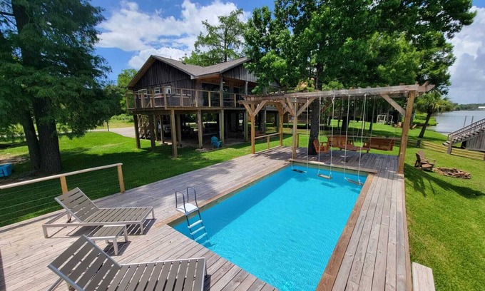 Barrett House | Houston Riverfront Getaway house with pool and hot tub