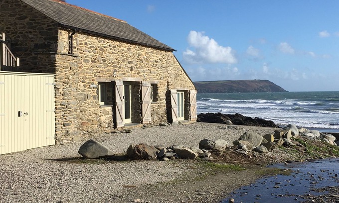Portholland Cottage | In an exceptional position right on the beach is this spacious and comfortable cottage - a perfect g