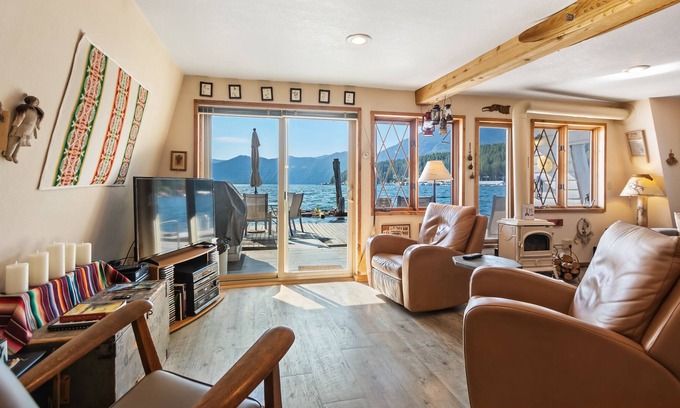 Bayview House | Incredible lakefront floating home with mountain views, balcony, & gas fireplace