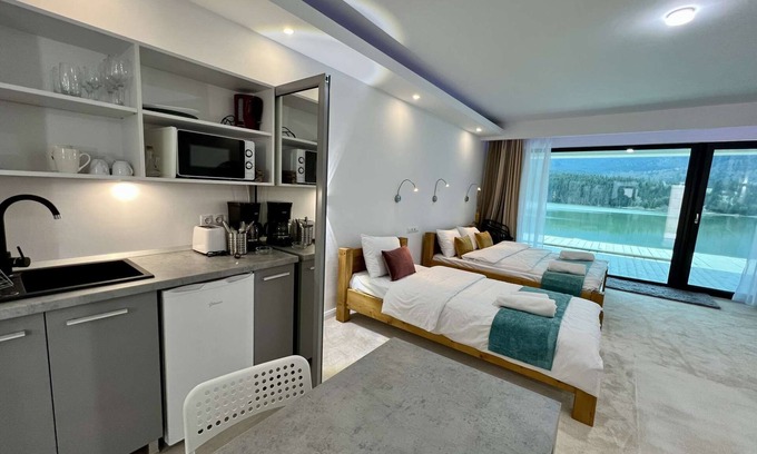 Colibita Apartment | Incredible room with lake view at Lake Colibita, next to the lake.