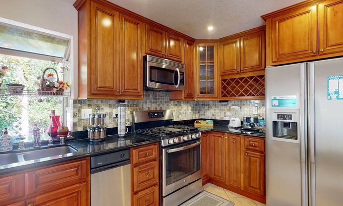 Fremont House | Inviting home with pool, fitness area, fireplace, & W/D