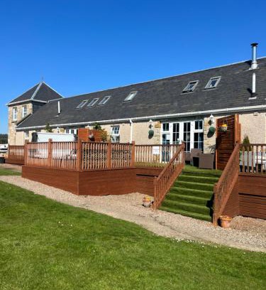 Kelty Apartment | JOIVY Greenknowes Lodge with Hot Tub and Wood Burning Stove