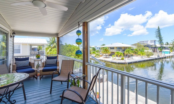 Breezeswept Beach Estates House | Key Blessing: Experience the Keys Life at This Charming 3BR Canal Front Home, Dockage & Dog-Friendly