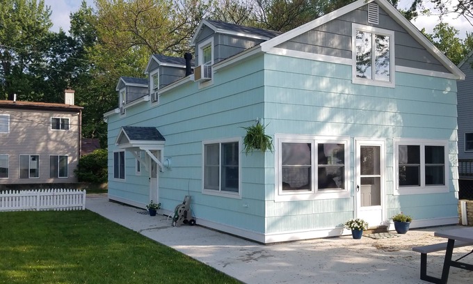 Gypsum House | Lake Front Nautical Themed Home with Private Yard & Sandy Bottom Water Access!