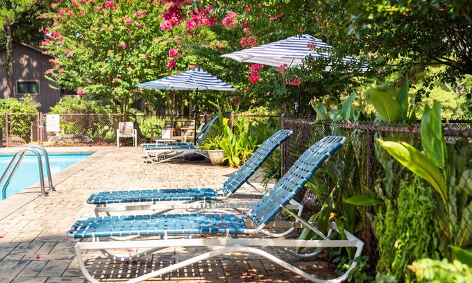 Mount Ida Cottage | Lake view three bedroom, three bath cottage with private hot tub overlooking Lake Ouachita. by RedAwning