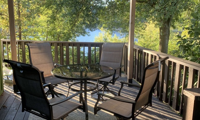 Springdale House | Lakeside house with fireplace, deck, and a fenced backyard with firepit.