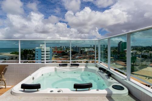 Piata Apartment | Loft aconchegante, vista mar lateral, vaga privativa