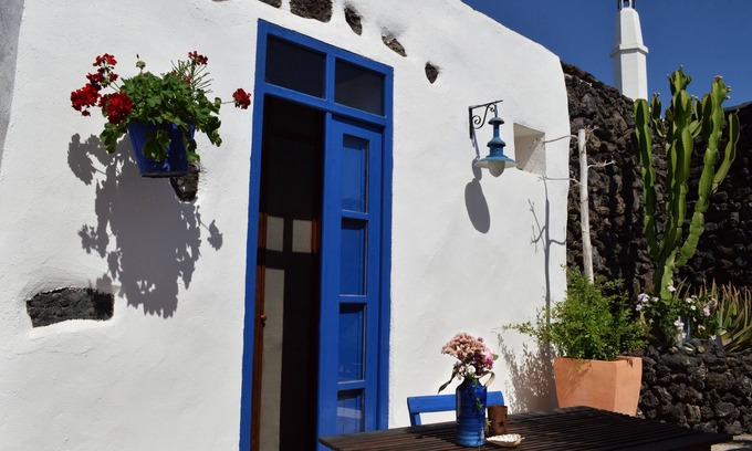 Uga Apartment | Loft-style studio with private, secluded outdoor area in historic finca