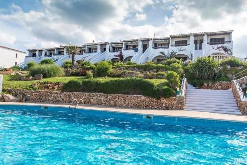 Arenal d'en Castell Apartment | Lovely hideaway with pool and white sand beach