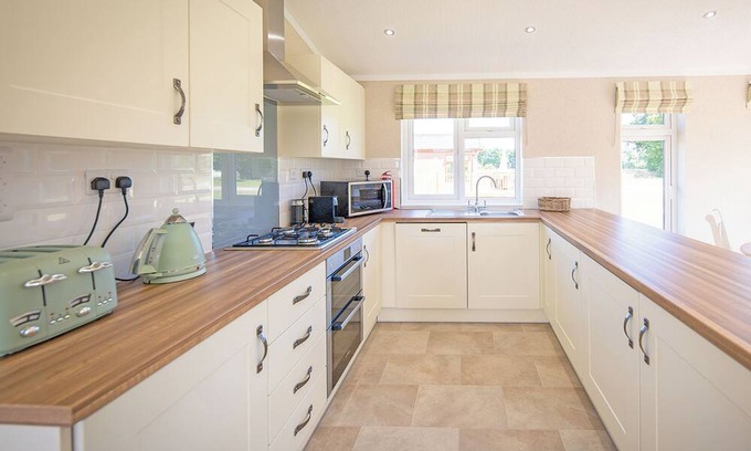 Diss Ski Chalet | Luxury lodge with one double with freestanding bath.