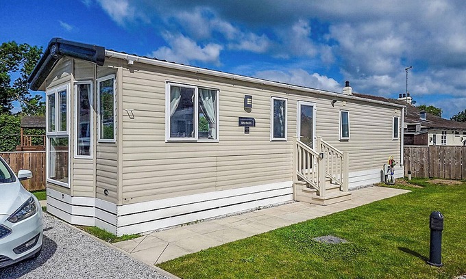 Arnold House | Modern holiday home with a large comfortable living area and dining area.