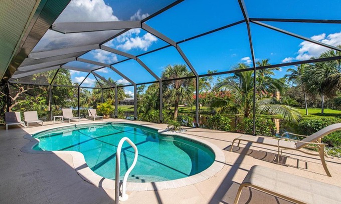 Palm River Estates Villa | Palms and Pool home in Naples best beaches and national parks