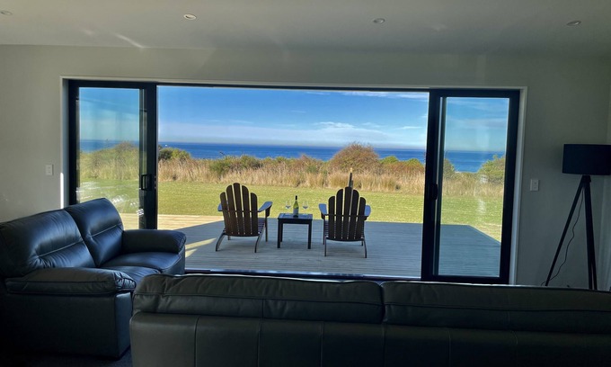Surat Bay House | Panoramic views of the ocean close enough to the beach to hear the waves.