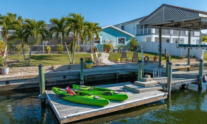 Bal Harbour House | Pirates Den a 4BR Pet-Friendly Waterfront Oasis with Pool, Dock, Personal Water Boats, Fire Pit, Game Room and Bar