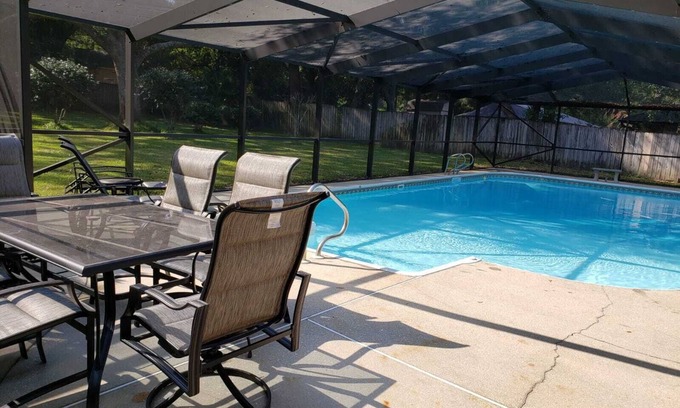 North Northwest Pensacola House | Private Getaway with Screened Pool, Upscale Kitchen, & Large Private Fenced Yard