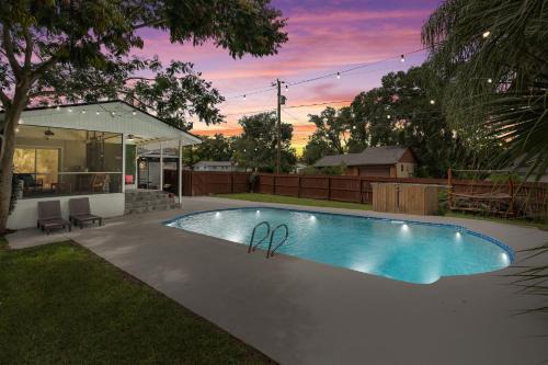 Forest City House | Resort-style home with a Heated Pool and a Huge Gated Yard