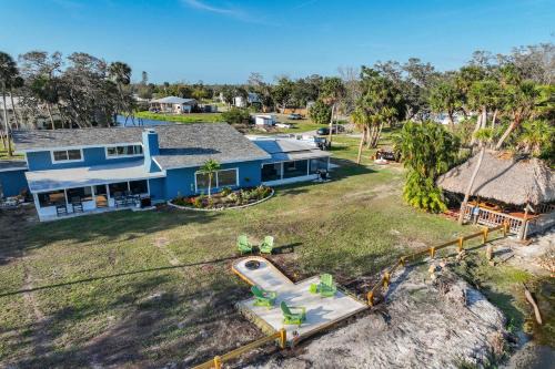 Braden River House | Riverside Oasis Home w Tiki Hut & Firepit