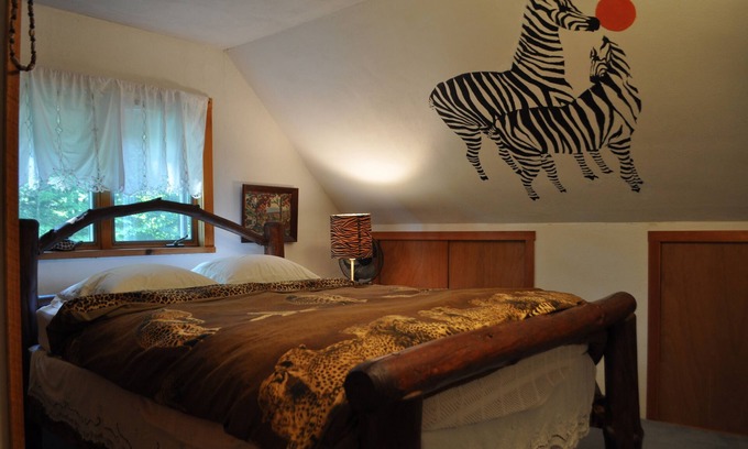 Spencer Bed & Breakfast | Russian and South African room in cabin surrounded by state forest