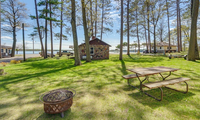 Stone Lake Cabin | Rustic Cabin w/Fire Pit, Steps to Sand Lake!