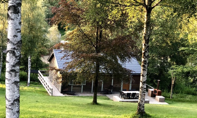 Buellingen Ski Chalet | Scandinavian chalet in lush greenery and forest .