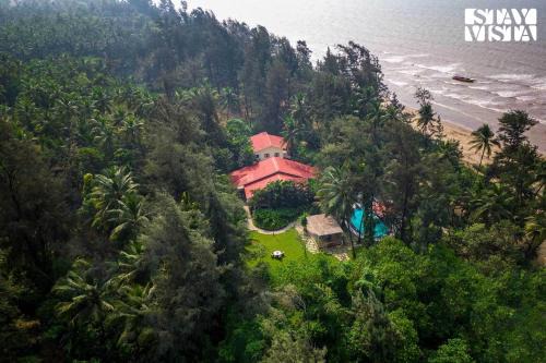 Nagaon Villa | Sea Breeze by StayVista - Beachside bliss with a splash of creativity with Pool, gazebo, lush lawn, and an artistically inspired house