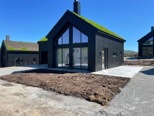 Fidjeland House | Soleiknuten Ålsheia Moderne Hytte i Naturskjønne Omgivelser