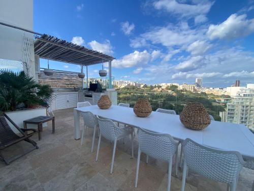 Il-Balluta Apartment | St Julians Luxurious Penthouse with POOL Enjoying Distant SEAVIEWS
