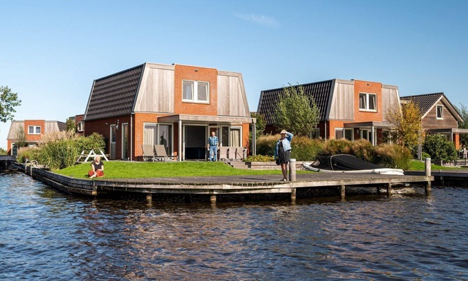 Akkrum House | Stay in our spacious Sneekermeer 8 home with private jetty.