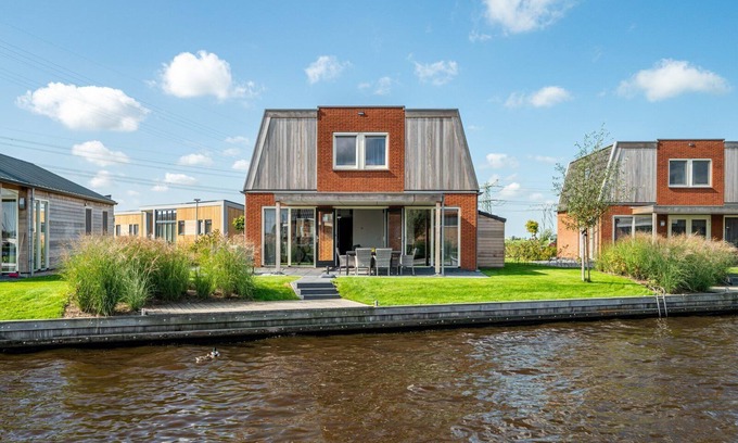 Akkrum House | Stay in our spacious Sneekermeer 6 home with private jetty.
