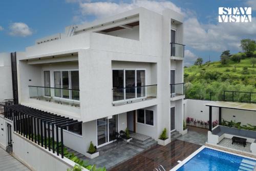 Khodala Villa | StayVista at Oriana Palms with Wifi and Pool