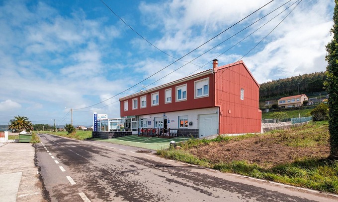 Merexo Apartment | Step into a practically equipped vacation apartment, close to picturesque stretches of coastline and