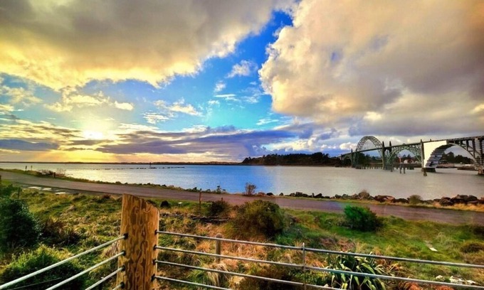 Newport Condo | Storm-watch haven with sweeping Bay, Bridge & South Jetty waterfront views