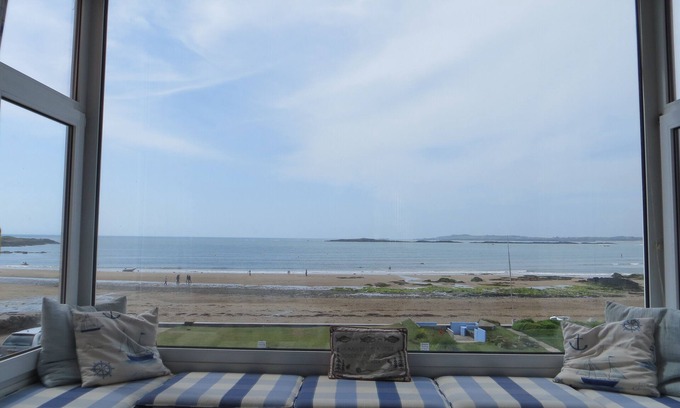 Rhosneigr House | Stunning bay views and sunsets seen from all main rooms. Games room. Wetroom.