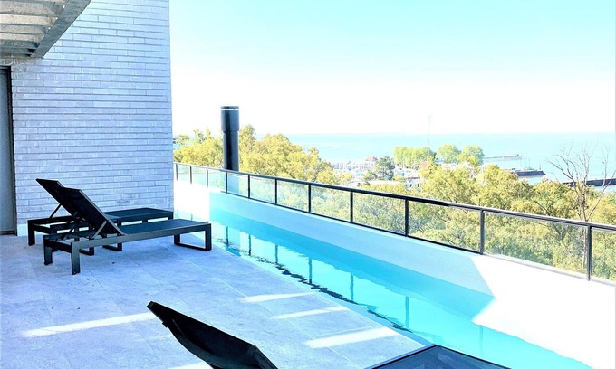 Olivos Apartment | Stylish apartment by river with pool & grill