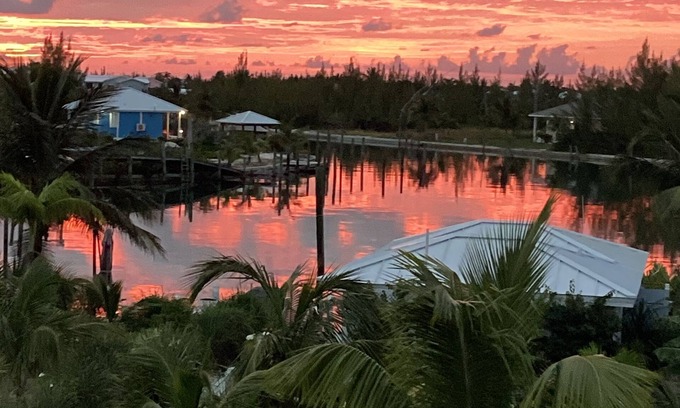 Treasure Cay Condo | Sunset condo with private deck and dock . Steps away from Windward beach.