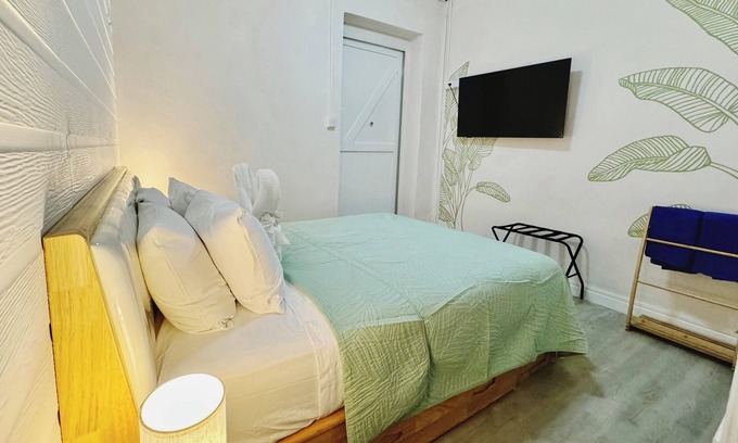 Bridgetown Hotel | The Banana Leaf room at Eden On The Sea. Beachfront, AC, WiFi.